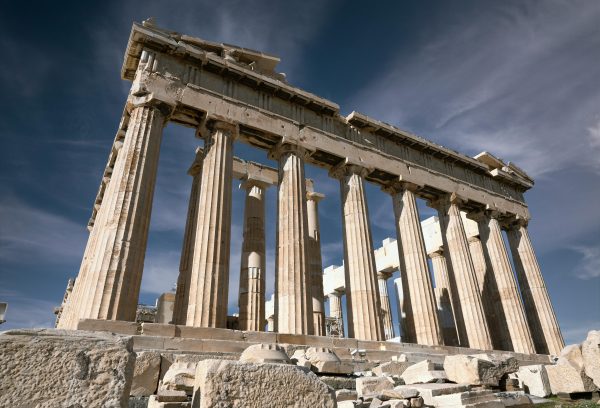 Experience the grandeur of ancient Greek architecture at the Parthenon in Athens under a clear blue sky.