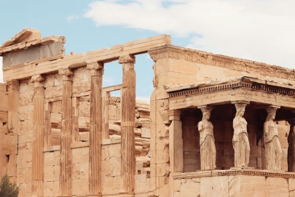 Close-up of the Erechtheion Temple's iconic caryatids on the Acropolis in Athens, Greece.